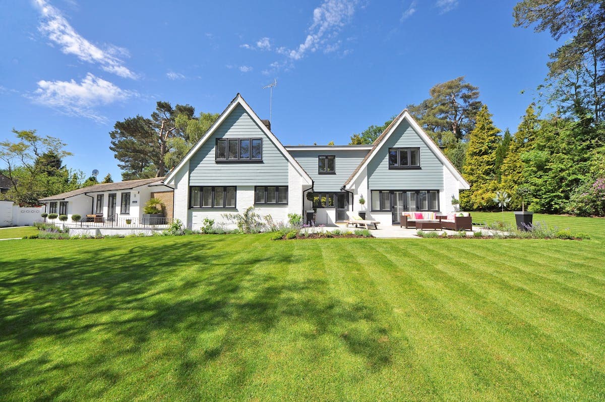 Well-kept residential property with a clean striped lawn